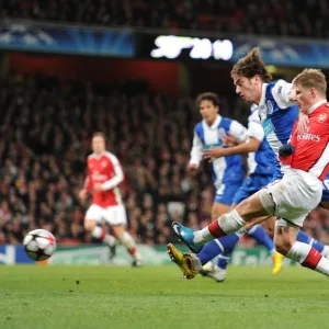 Andrey Arshavin (Arsenal) Nuno Coelho (Porto). Arsenal 5: 0 FC Porto, UEFA Champions League First Knockout Round, Second Leg, Emirates Stadium, Arsenal Football Club, London, 9 / 3 / 2010. Credit : Stuart MacFarlane /