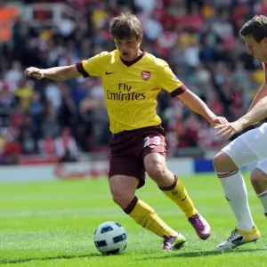 Andrey Arshavin (Arsenal) Robert Huth (Stoke). Stoke City 3: 1 Arsenal. Barclays Premier League