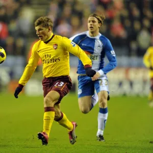 Andrey Arshavin (Arsenal) Ronnie Stam (Wigan). Wigan Athletic 2: 2 Arsenal