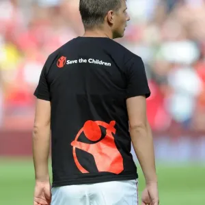 Andrey Arshavin in a Save the Children t-shirt Print