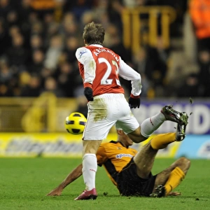 Andrey Arshavin (Arsenal) tackled by Karl Henry (Wolves). Wolverhampton Wanderers 0
