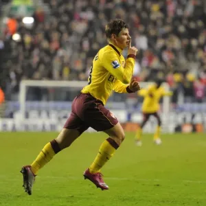 Andrey Arshavin celebrates scoring the 1st Arsenal goal. Wigan Athletic 2: 2 Arsenal