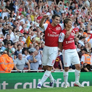 Andrey Arshavin celebrates scoring Arsenals goal with Robin van Persie