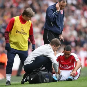 Andrey Arshavin checks on Theo Walcott
