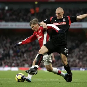 Andrey Arshavin holds off Andy Wilkinson (Stoke) on his way to scoring Arsenals 1st goal