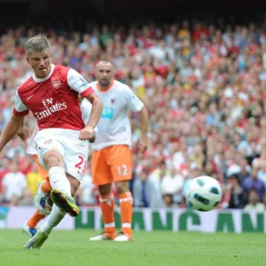 Andrey Arshavin shoots past Blackpool goalkeeper Matthew Gilks from the penalty spot to score the 2nd Arsenal goal. Arsenal 6: 0 Blackpool, Barclays Premier League, Emirates Stadium, Arsenal Football Club, London, 21 / 8 / 2010. Credit : Stuart MacFarlane / Arsenal