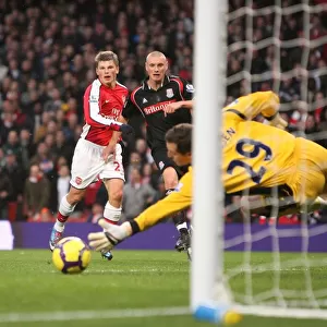 Andrey Arshavin shoots past Stoke City goalkeeper Thomas Sorensen to score the 1st Arsenal goal