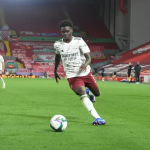 Empty Anfield: Bukayo Saka Leads Arsenal Against Liverpool in Carabao Cup Clash Amidst Pandemic