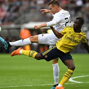 Angers vs. Arsenal: Eddie Nketiah Clashes with Romain Thomas in Pre-Season Friendly
