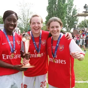 Anita Asante, Gemma Davison and Karen Carney (Arsenal) with the European Trophy