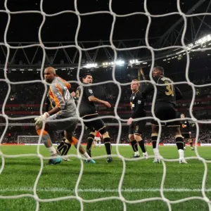 Antolin Alcaraz (Wigan No. 3) scores an own goal for Arsenals 1st goal