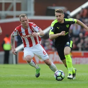 Aron Ramsey vs. Glenn Whelan: Intense Battle in Stoke City vs. Arsenal Premier League Clash