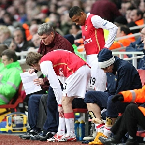 Arsenal assistant manager Pat Rice talks with substitutes Alex Hleb and Gilberto