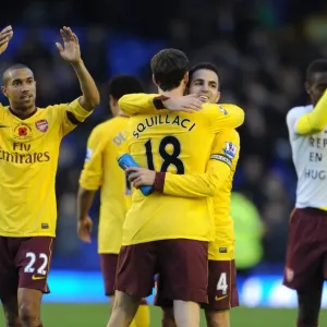 Arsenal captain Cesc Fabregas celebrates after the match with Sebastien Squillaci