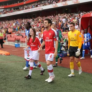 Arsenal captain Cesc Fabregas followed by Vito Mannone Arsenal captain Cesc Fabregas followed by Vito Mannone