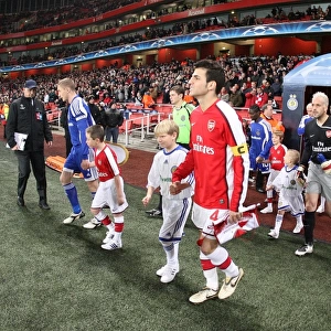 Arsenal captain Cesc Fabregas leads the team out for the first time