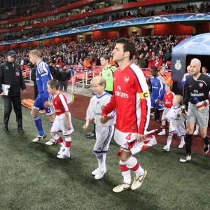 Arsenal captain Cesc Fabregas leads the team out for the first time