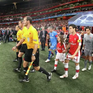 Arsenal captain Cesc Fabregas leads out the team before the match