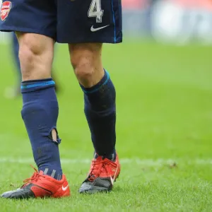 Arsenal captain Cesc Fabregas socks after a challenge from a Stoke player