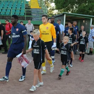 Arsenal captain Kolo Toure leads out the team before the match Arsenal captain Kolo Toure leads out the team before the match