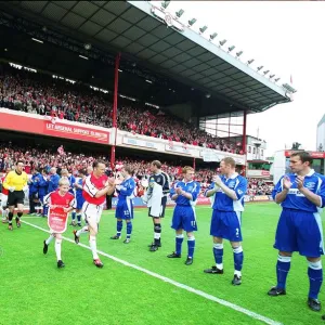 Arsenal captain Lee Dixon leads the team out onto the pitch for the match