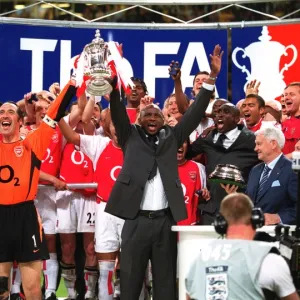 Arsenal captain Patrick Vieira and vice-captain David Seaman lift the FA Cup