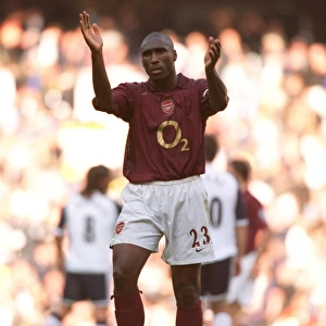 Arsenal captain Sol Campbell applauds the fans after the match