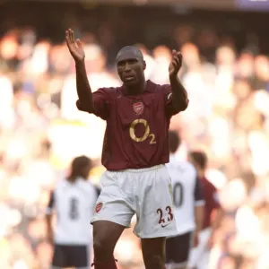 Arsenal captain Sol Campbell applauds the fans after the match
