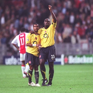 Arsenal captain Sol Campbell and Ashley Cole celebrate after the match