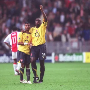 Arsenal captain Sol Campbell and Ashley Cole celebrate after the match