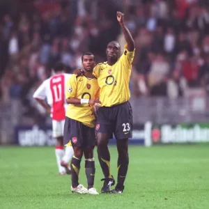 Arsenal captain Sol Campbell and Ashley Cole celebrate after the match