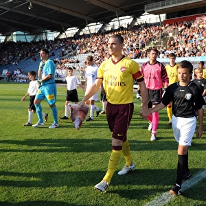 Arsenal captain Thomas Vermaelen leads the team out before the match. Sturm Graz 0
