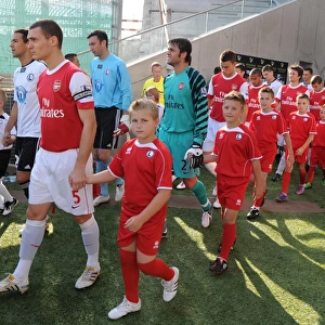 Arsenal captain Thomas Vermaelen leads out the team before the match. Legia Warsaw 5