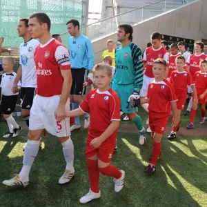 Arsenal captain Thomas Vermaelen leads out the team before the match. Legia Warsaw 5 Arsenal captain Thomas Vermaelen leads out the team before the match. Legia Warsaw 5