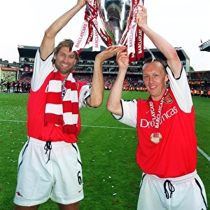 Arsenal captain Tony Adams and Lee Dixon lift the F. A