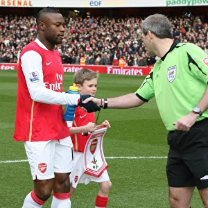 Arsenal captain William Gallas shakes hands with referee Martin Atkinson before the match