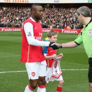Arsenal captain William Gallas shakes hands with referee Martin Atkinson before the match