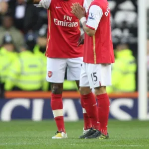 Arsenal captain William Gallas talks with Denilson before the match