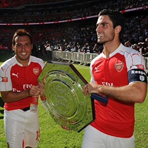 Arsenal Celebrate Community Shield Victory over Chelsea (2015-16): Santi Cazorla and Mikel Arteta Rejoice