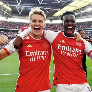 Arsenal Celebrate Community Shield Victory over Manchester City (2023-24): Martin Odegaard and Edward Nketiah Rejoice in Glory