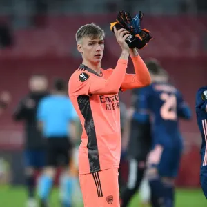 Arsenal Celebrate Europa League Victory over Rapid Wien: Alex Runarsson's Triumphant Clap