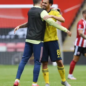 Arsenal Celebrate FA Cup Quarterfinal Victory Over Sheffield United: Dani Ceballos and Hector Bellerin Embrace