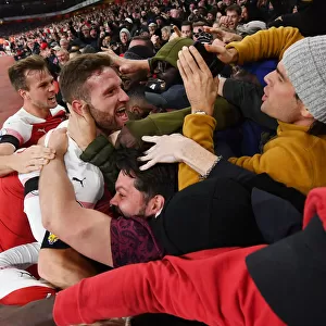 Arsenal Celebrate Goal Against Liverpool: Holding, Mustafi, and Ecstatic Fans