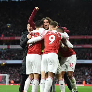 Arsenal Celebrate Third Goal Against Tottenham in Premier League Clash
