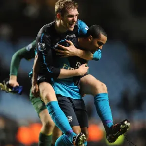 Arsenal Celebrate Premier League Victory: Per Mertesacker and Theo Walcott