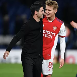 Arsenal Celebrate Victory Over Chelsea in Premier League Clash: Mikel Arteta and Martin Odegaard