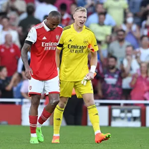 Arsenal Celebrate Win Against Fulham: Ramsdale and Magalhaes Embrace