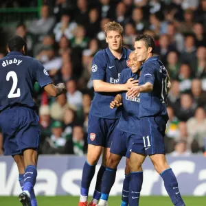 Arsenal Celebrates Double Strike: Diaby, Bendtner, Clichy, and van Persie Rejoice after 2-0 Goals vs. Celtic, UEFA Champions League Play-off Round 1st Leg, 2009 Arsenal Celebrates Double Strike: Diaby, Bendtner, Clichy, and van Persie Rejoice after 2-0 Goals vs. Celtic, UEFA Champions League Play-off Round 1st Leg, 2009