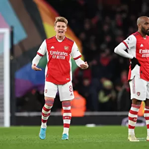 Arsenal Celebrates First Goal: Martin Odegaard Rallies Fans vs. Wolverhampton Wanderers (2021-22)