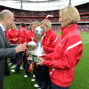 Arsenal CEO Ivan Gazidis hand the trophy to Faye White of the Arsenal Ladies